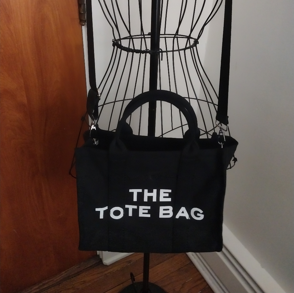 The Tote Bag . Black Tote Bag NWOT Excellent Condition.